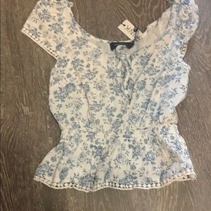 White and blue floral shirt